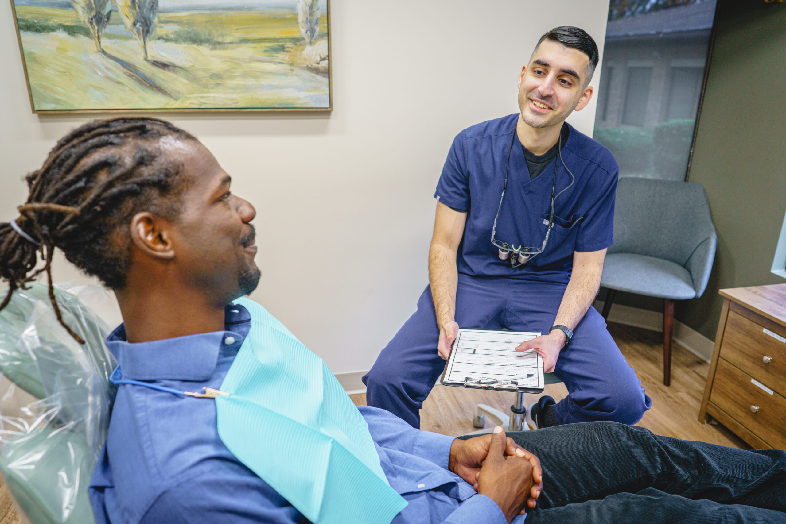Dentist consulting patient at Fox Family Dentistry in Springfield and Burke, VA
