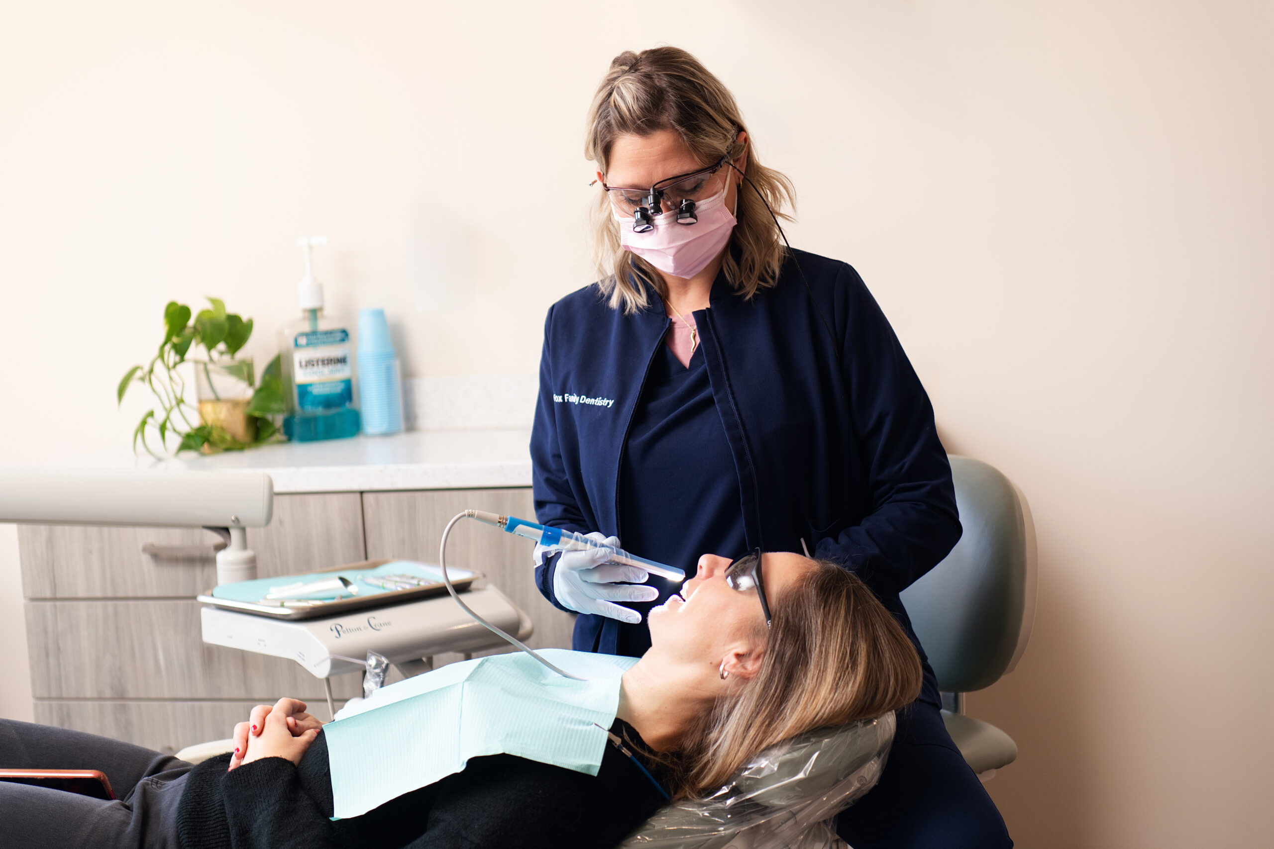 Dentist from Fox Family Dentistry examining patient's teeth in Springfield and Burke, VA